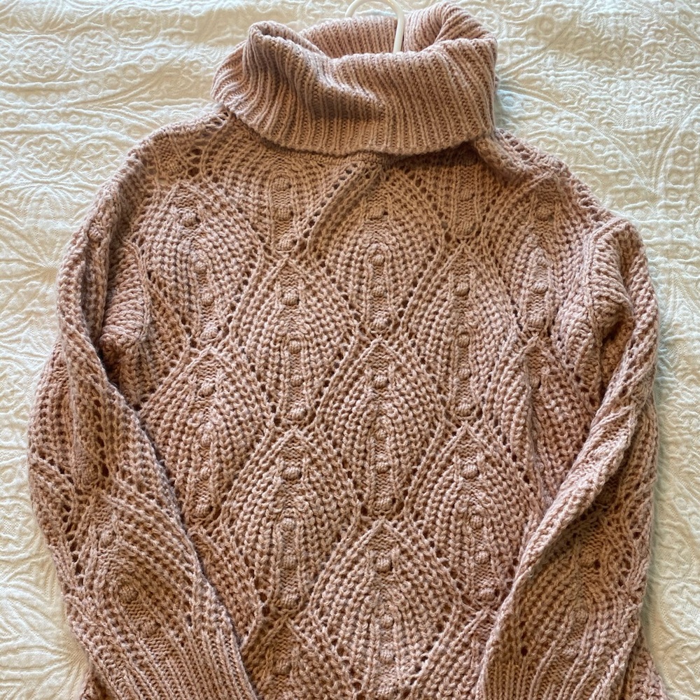 Pink turtleneck sweater